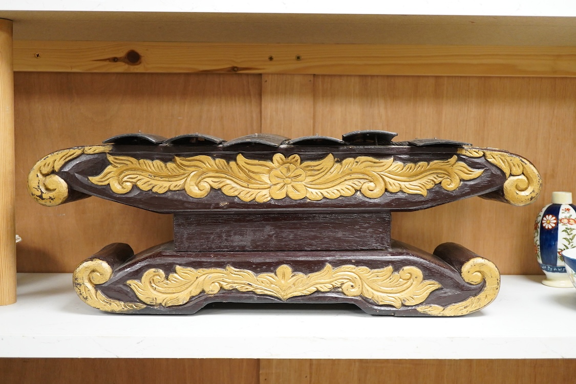 A carved and gilt Balinese Gamelan, 60cm